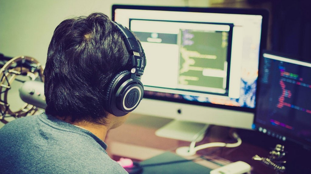 increase programmer productivity coding laptop headphone apple working