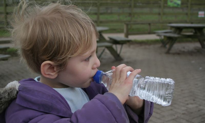 cute child drinking water, cute boy child drinking water from bottle, cute child, cute boy child